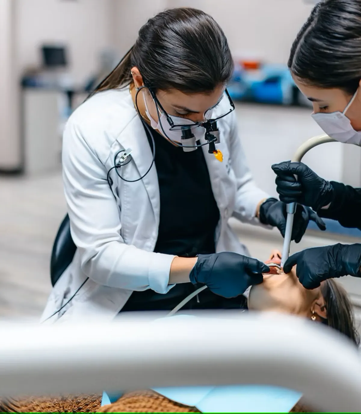 Dr. Revan Dawood performing a dental procedure